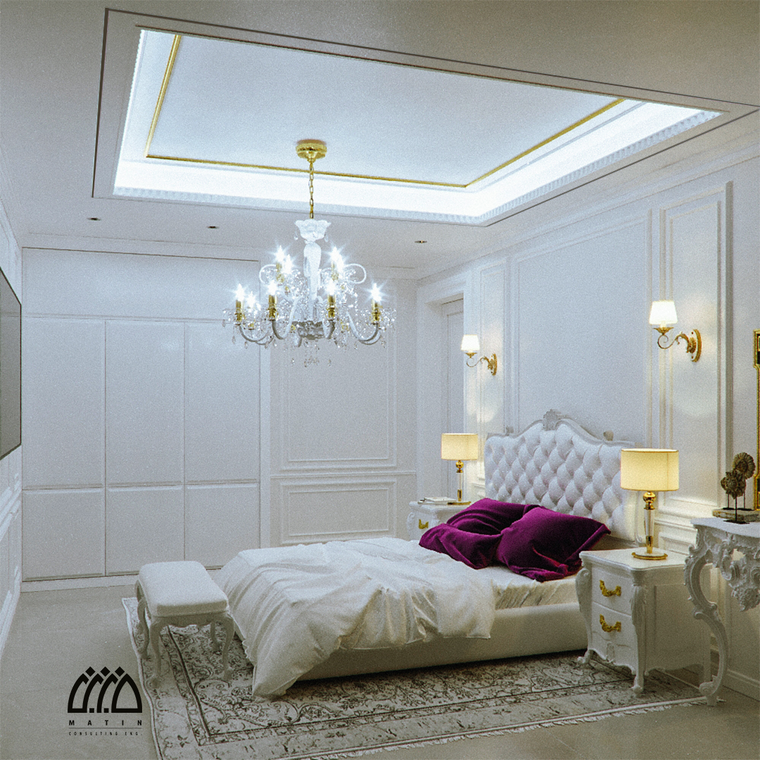 اتاق خواب کلاسیک عمارت بهستان با تاج تخت کپیتونه سفید، کوسن بنفش و دیوار قاب‌بندی‌شده با نوار طلایی